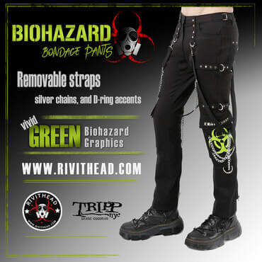 Black bondage pants with silver chains, lime green biohazard symbols, and metal strap accents, styled with platform boots