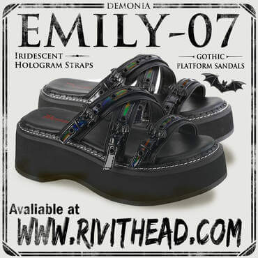 Black strappy platform sandals with iridescent criss-cross straps and ornamental black bat buckle on toe strap