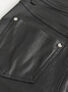 Close-up of a black pocket on women's alternative punk pants with silver studs.