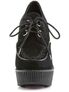 Front view of CREEPER-302 black vegan wedges with lace-up closure and ribbed platform sole