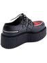 Rear angle of CREEPER-406 black platform shoe with ribbed sole, lace-up front, and zipper detail
