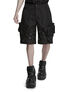 Black utility cargo shorts with side pockets worn with black boots on a model