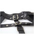 Close-up of Fated long sleeve harness in black faux leather with silver buckles and grommet details