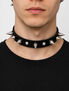 Black leather choker with silver cone studs worn by a male model