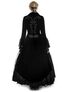 Back view of Paris Long Coat in black velvet with embroidered details and flared lace hem