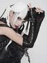 Model wearing black mesh gloves with long lace-up sleeves and chain details