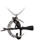 A silver pendant featuring a cat sitting on a crescent moon with a broomstick design.