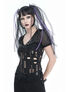 A model wearing a black slashed top with cutouts and decorative rings, styled with long purple hair.