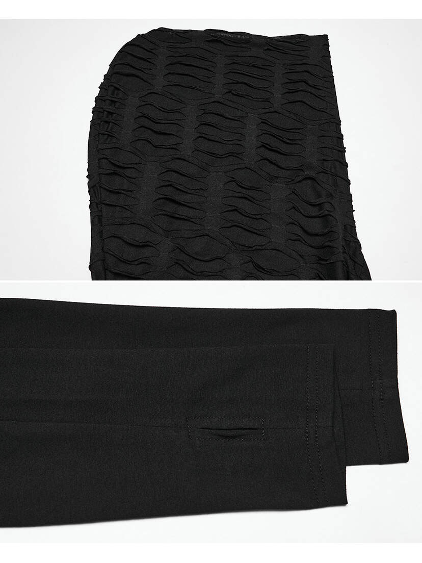 Black Apocalypse hoodie fabric with textured and smooth panel close-up