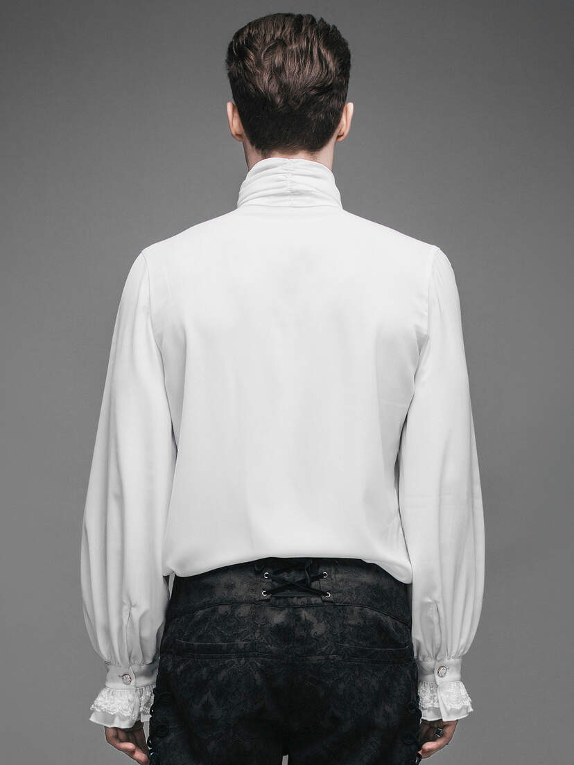 Back view of a man wearing a white ruffle shirt with long sleeves and a high collar