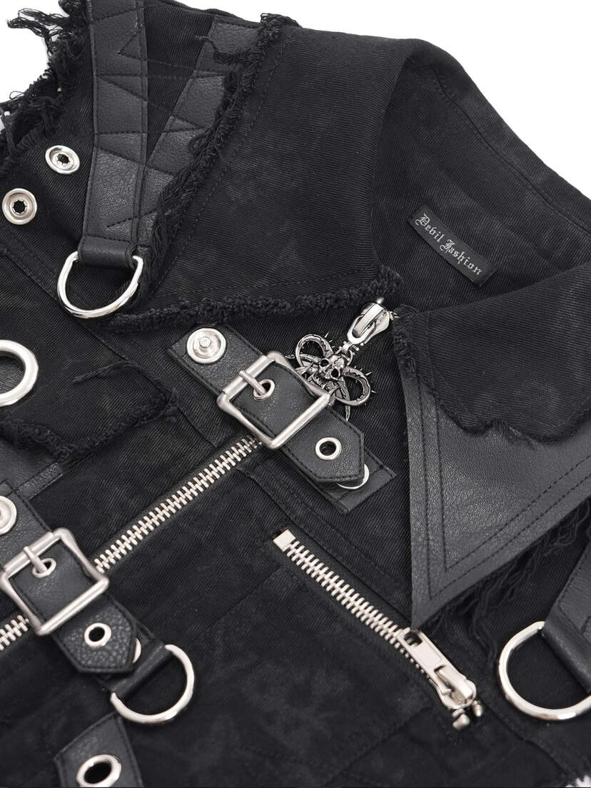Badlands Strap Vest Close-up of a black vest featuring zippers, buckles, and decorative elements.