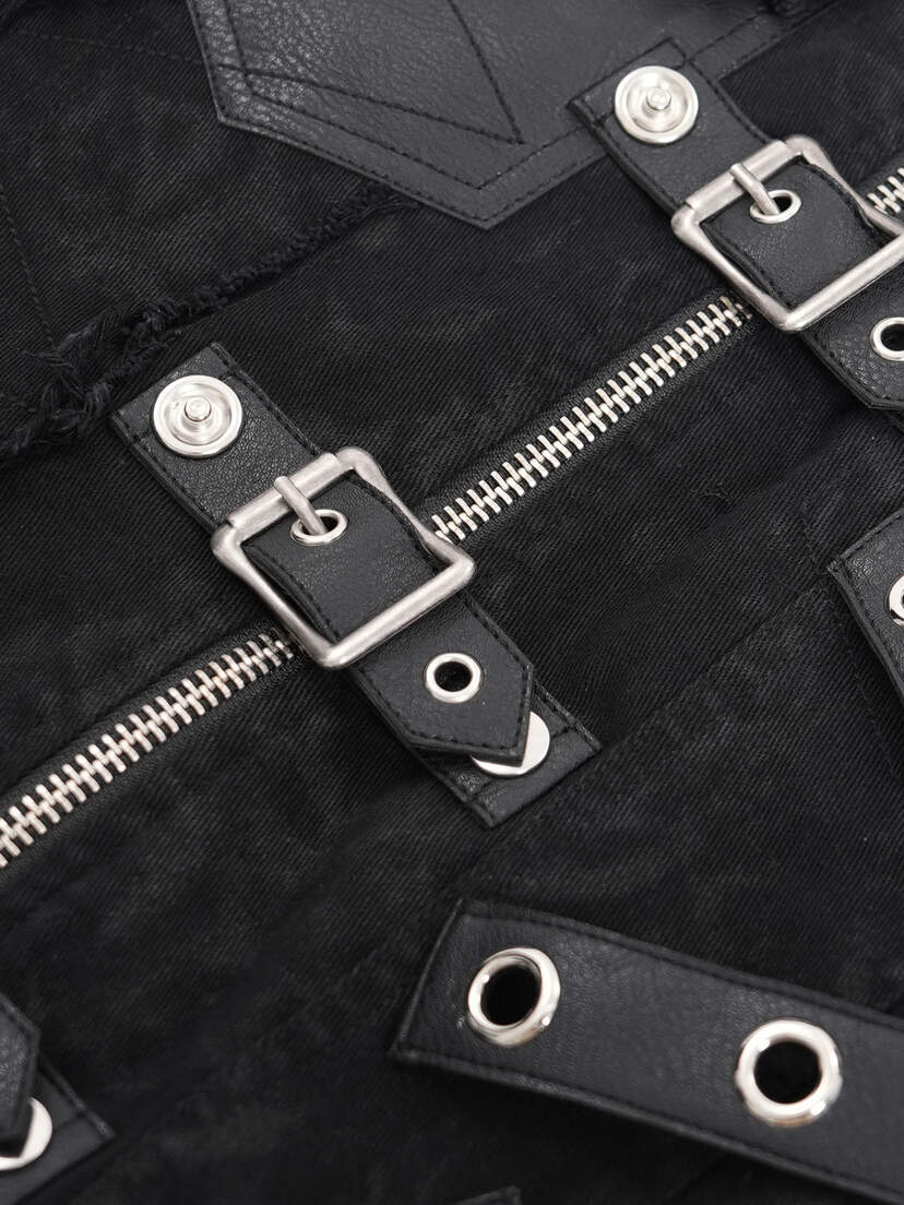 Badlands Strap Vest Close-up of the Badlands Strap Vest showing black fabric, silver buckles, and zipper details.