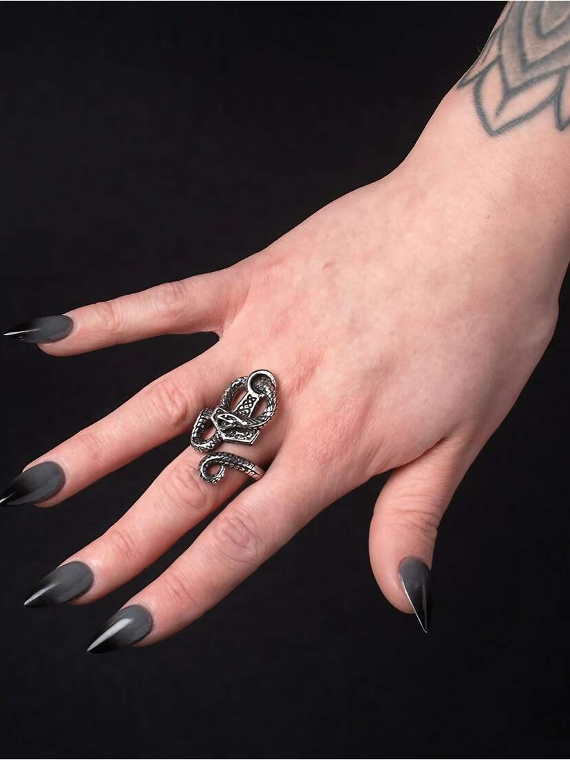 Bane of Thor Hammer Ring A hand with long, dark nails wearing a silver Bane of Thor Hammer Ring on the index finger.