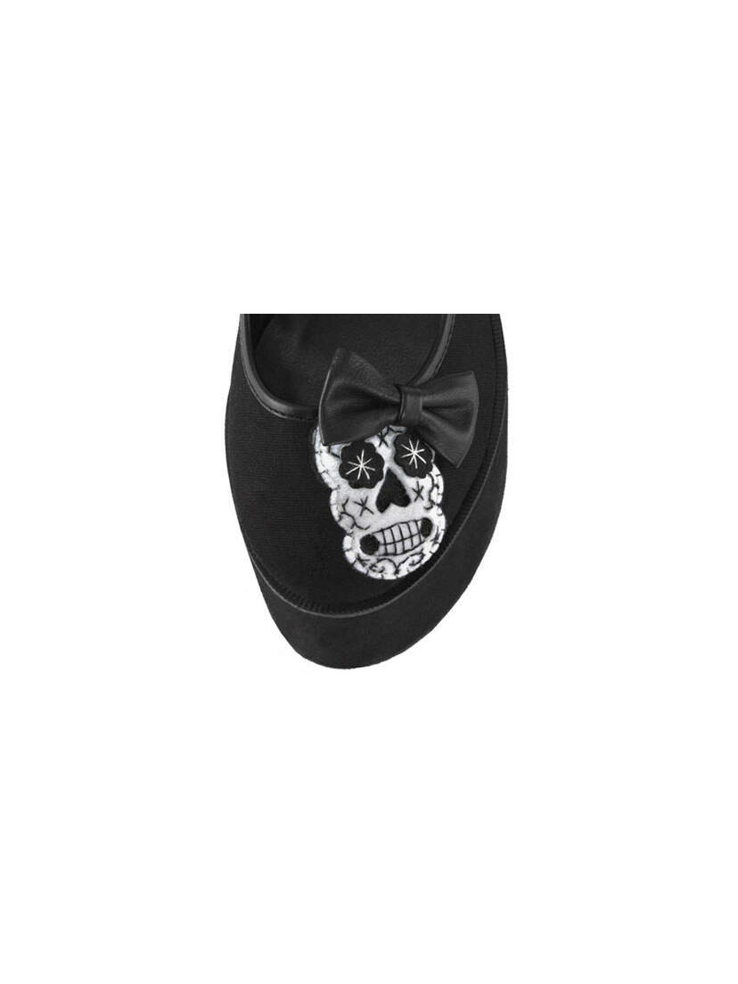 Close-up of CLICK-02-3 Skull Platform Shoes with embroidered white skull and black bow on black upper