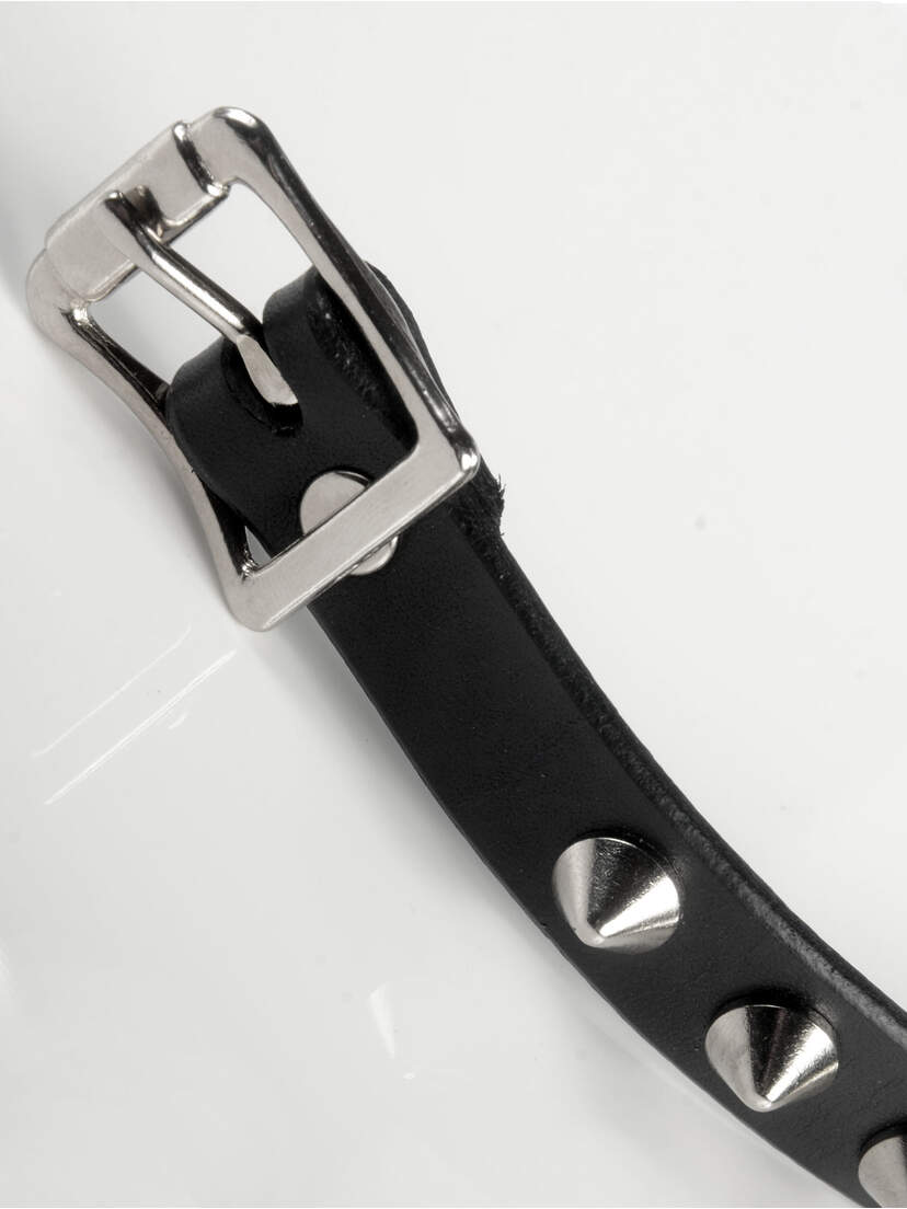 Real Leather Cone Spike Wristband Black leather wristband with silver buckle and cone spikes