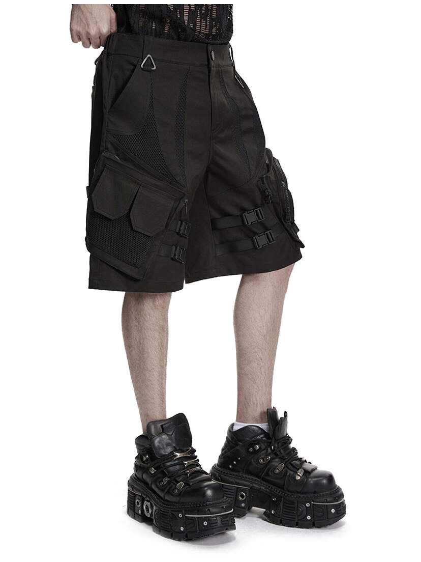 Darkcore Utility Cargo Shorts Black cargo shorts worn with black boots, side view on a white background
