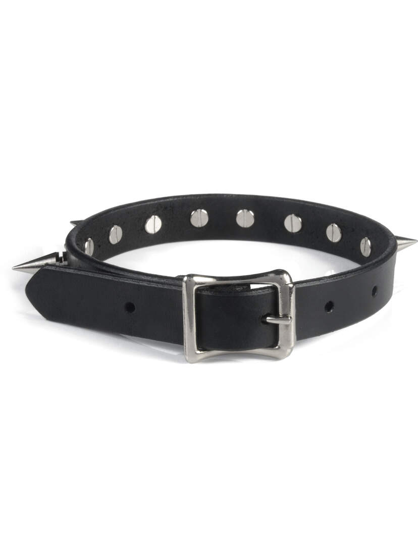 Black leather choker with silver buckle and punched holes, shown flat on white background