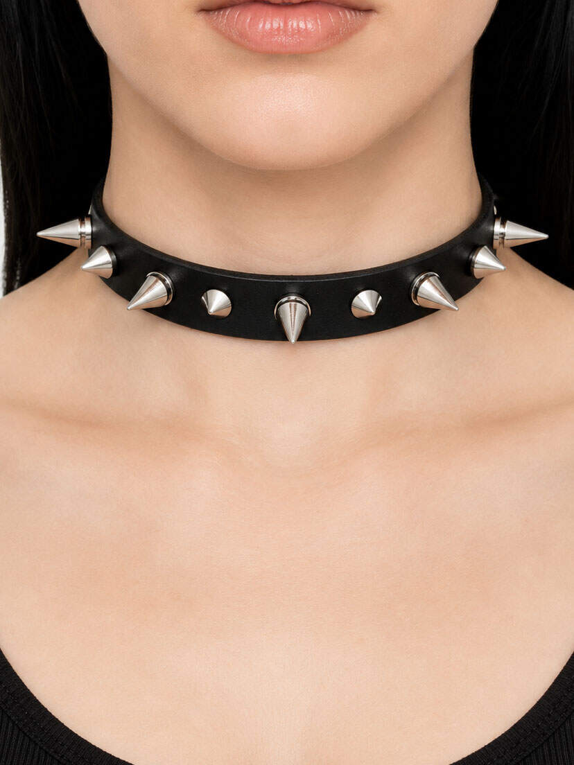 Black leather choker with silver spikes and studs on a model's neck