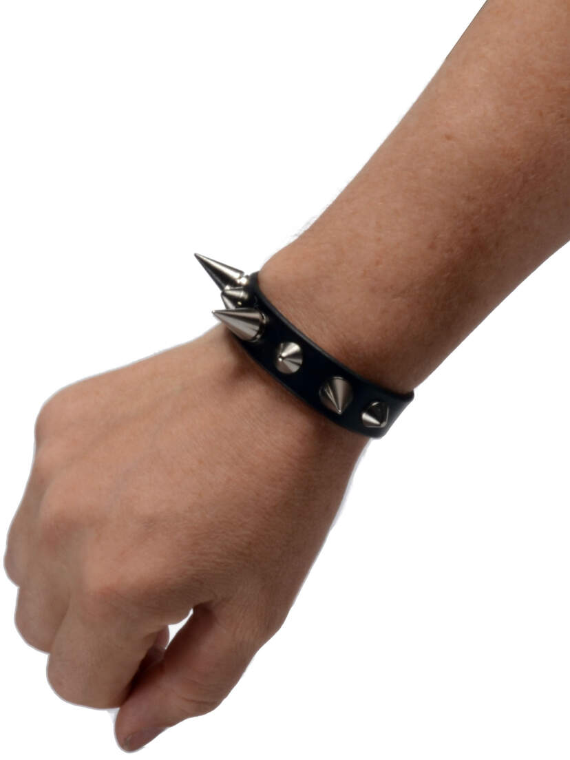 Mad-Dog Spiked Leather Wristband Black spiked leather wristband on a wrist with silver studs and pointed accents