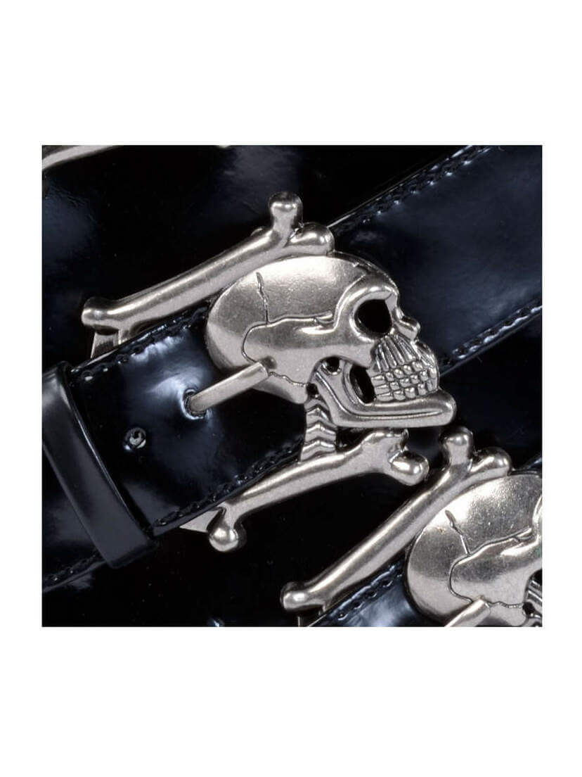 Close-up of BROGUE-06 Skull Buckle Boots with silver skull and crossbones buckles on black patent straps