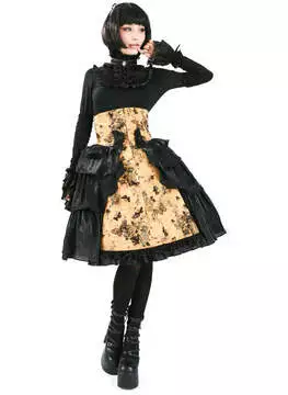 Front view of a model wearing a yellow Gothic Lolita skirt with black lace and ruffle details, paired with a black top and accessories.