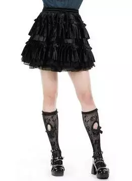 Close-up of black velvet gothic lolita frilly layered mini skirt with ruffled details and zipper