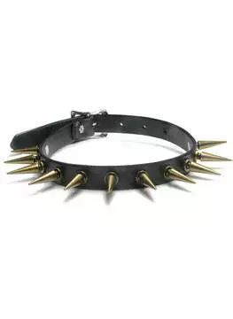 Close-up of a black leather choker with 1 1/4 inch tall brass spikes and adjustable buckle