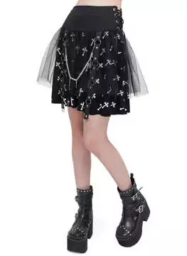 Front view of Christina Crossed Skirt with black fabric, star and moon print, tulle overlay, and chain detail