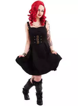 Front view of a woman in a black steampunk dress with lace sleeves and corset-style bodice, paired with black boots
