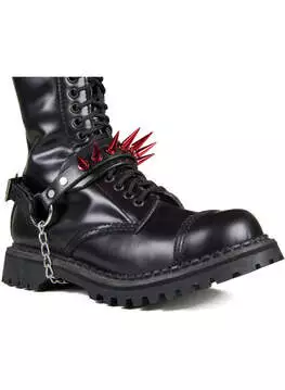 Front view of black combat boots with red spike embellishments, chain detail, and chunky sole
