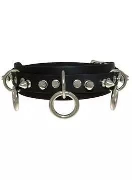 Close-up of a black leather choker with three rings and small spikes, front view
