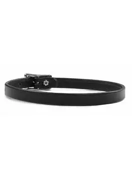Close-up of a black leather choker with a smooth finish, worn around a mannequin's neck