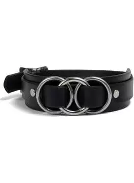 Close-up of a black vegan leather choker with three silver rings in the center