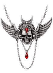 A woman wearing the Immortal Ayesha Winged Skull Necklace with red lipstick and dramatic eye makeup.